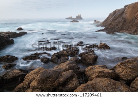 Rocky Coastline - Seal Rock, Laguna Beach, CA. This image shows a typical Californian rocky coast. This photo was captured near Crescent Bay, Laguna Beach, California. In the distance is Seal Rock.