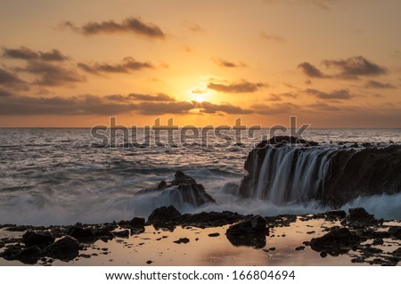 Sunset of rocky coastal seascape. This is an image of a rocky coastal seascape.  This photo was taken in Laguna Beach, CA.