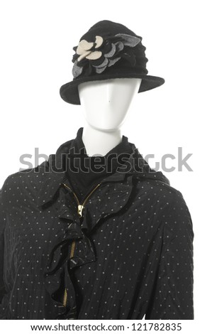 female clothing with scarf ,coat ,hat in hat on a mannequin