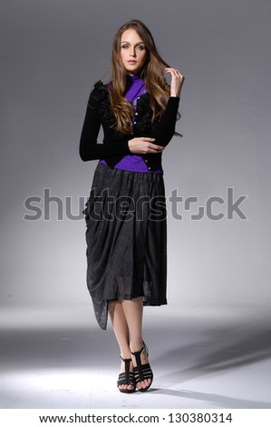 Young beautiful fashion woman in casuals posing - isolated Full length portrait