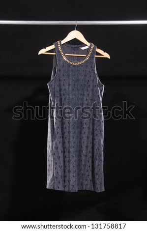 Woman clothes on a hanger isolated on black