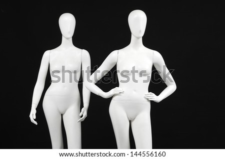 Two mannequin woman isolated on black