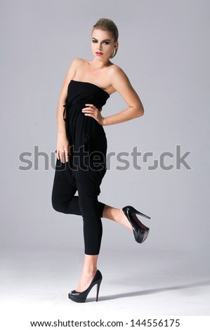 Full body Slim young cute fashion model in black dress.