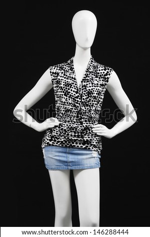 mannequin dressed in shirt on black background