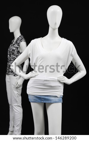 Two mannequin dressed in shirt and trousers