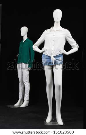 full-length Two mannequin dressed in shirt and trousers on black background