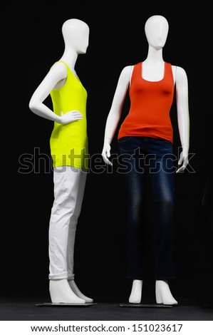 full-length set of mannequin dressed in two colorful t-shirt and trousers