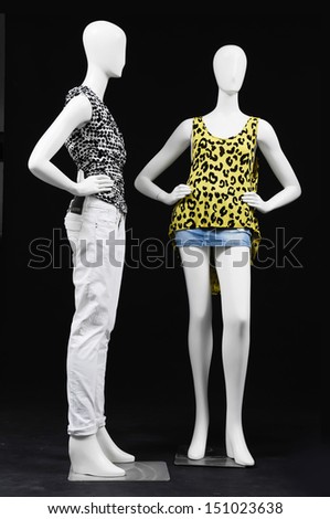 full-length Two mannequin dressed in fashion shirt and trousers on black background