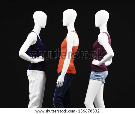 Row of Three mannequin female dress and isolated on black background
