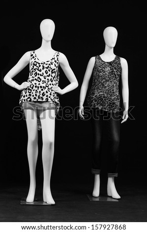full-length Two mannequin dressed in shirt and trousers- black and white