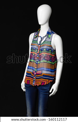 mannequin dressed in fashion shirt and trousers-black background