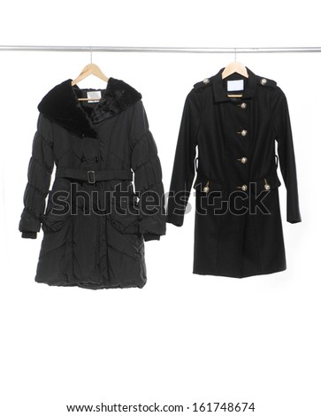 Two black coat clothes on a hanger