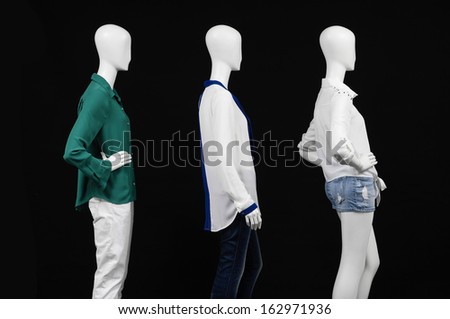 Side view three mannequin in dressed fashionably and isolated on black