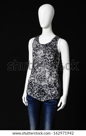 mannequin female dressed in fashion shirt and jeans Ã¢Â?Â?black background