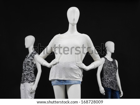 Set of Three mannequin colorful shirt and jeans on black background