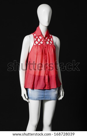 female mannequin red shirt and shorts Ã¢Â?Â?black background