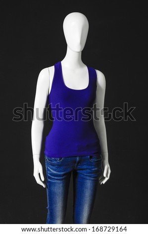 Set of mannequin dressed in two colorful shirt and trousers on black background