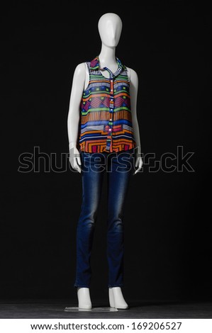 full-length mannequin dressed in colorful shirt and jeans