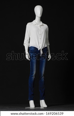 full-length Mannequin female white dress and jeans isolated on black background