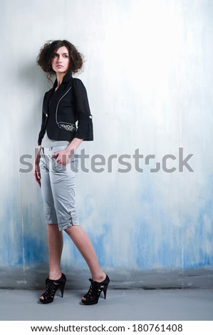 Full body beautiful casual young woman standing posing in studio