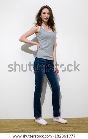 female model at fashion full body posing on the wooden floor