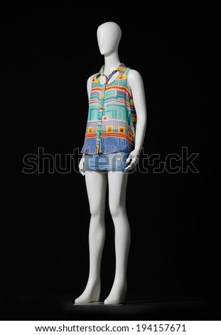 mannequin female dressed in shirt and short on black background