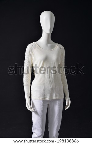 Mannequin female white shirt and white trousers on black