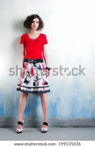 Full body beautiful young woman standing posing in studio
