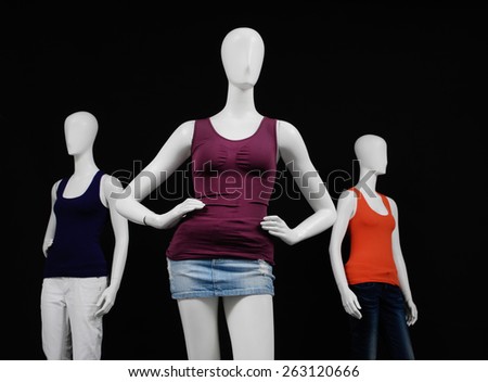 mannequin dressed in colorful shirt and trousers ,jeans on black background