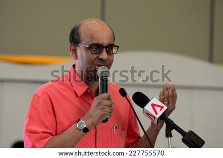 Singapore - October 19, 2013: Singapore's Deputy Prime Minister and Minister of Finance speaks at a public seminar. Mr. Shanmugaratnam is a Member of Parliament for Singapore's People's Action Party.