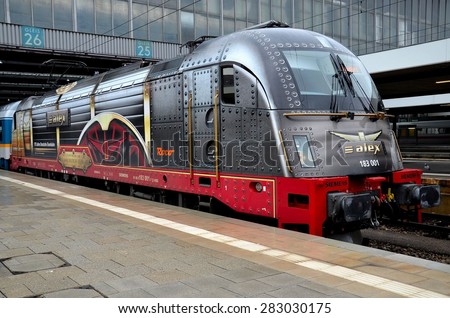 Munich, Germany - November 11, 2012: A uniquely painted Alex electric train engine stands at the Munich Hauptbahnhof central train station.