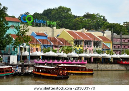 Singapore - January 12, 2013: A view of Clarke Quay with boats and restaurants. It is a historical quay upstream from the mouth of Singapore River with restored warehouses restaurants & nightclubs.