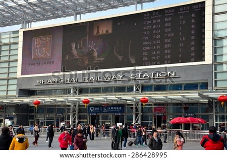 Shanghai, China - February 15, 2013: The entrance to Shanghai Railway station. Train travel is  popular and common as the rail network reaches most parts of the country.
