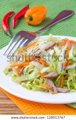 Crispy salad with pork, korean carrots and lettuce
