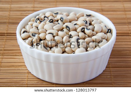 white beans in white ceramic cup