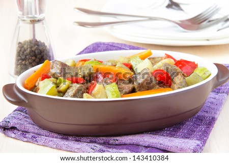 Braised meat stew with with beef, potatoes, zucchini, eggplant and red pepper in pot - traditional dish
