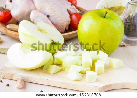 Cut cube green Apple prepared for the filling of chicken on table