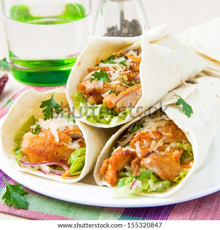 Wrapped In A Tortilla Roll With Spicy Fried Chicken And Vegetables Salad, Tasty Mexican Dish