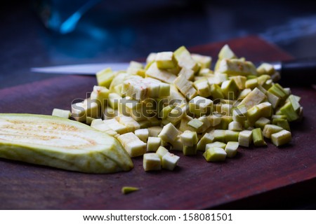 Diced eggplant on a cutting board, cooking dish