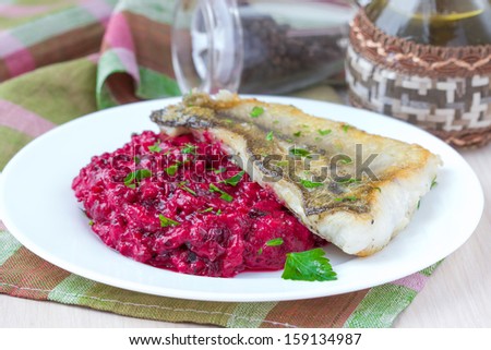 Fried fish fillet of perch with mashed beet and potato, elegant dinner