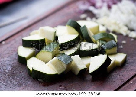 Cut into triangles fresh zucchini, cooking homemade dinner