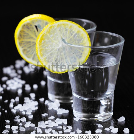 Two piles of silver tequila with salt and lemon, party bar