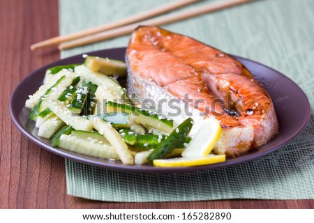 Red fish grilled salmon with cucumber salad and soy sauce, Japanese food