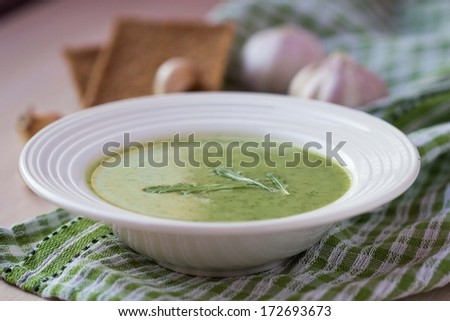 Green garlic cream soup with leaves rukola, arugula, healthy dietary vegetable dish