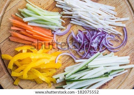 Thin chopped sticks of vegetables for cooking, zucchini, carrot, onion, celery, pepper