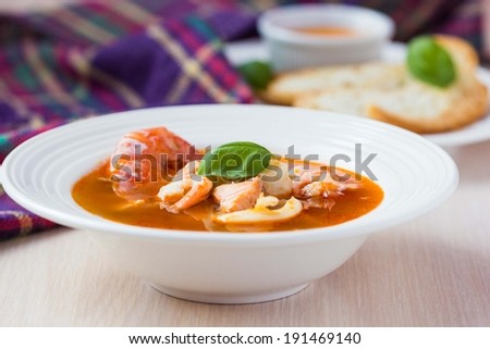 French Bouillabaisse fish soup with seafood, salmon fillet, shrimp, rich taste, tasty dinner