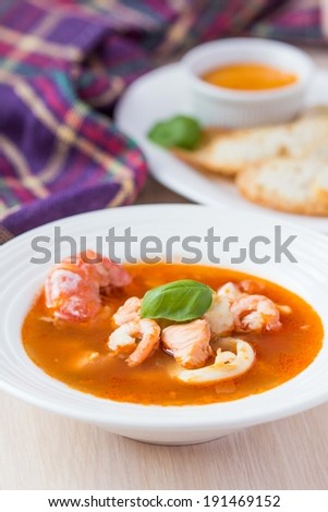 French Bouillabaisse fish soup with seafood, salmon fillet, shrimp, rich taste, tasty dinner