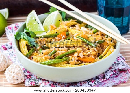 Asian fried rice with egg, vegetables, mini corn, peppers, green beans, delicious Chinese dinner