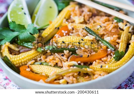 Asian fried rice with egg, vegetables, mini corn, peppers, green beans, delicious Chinese dinner