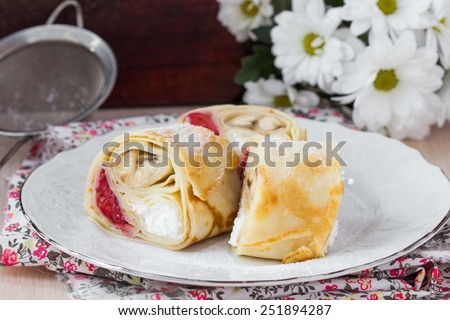 Tasty pancake rolls with three toppings, cheese, strawberries, banana, Shrovetide